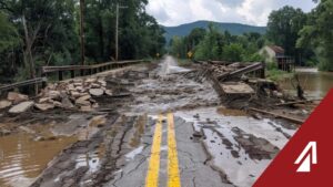 picture of flooding and a collapsed bridge