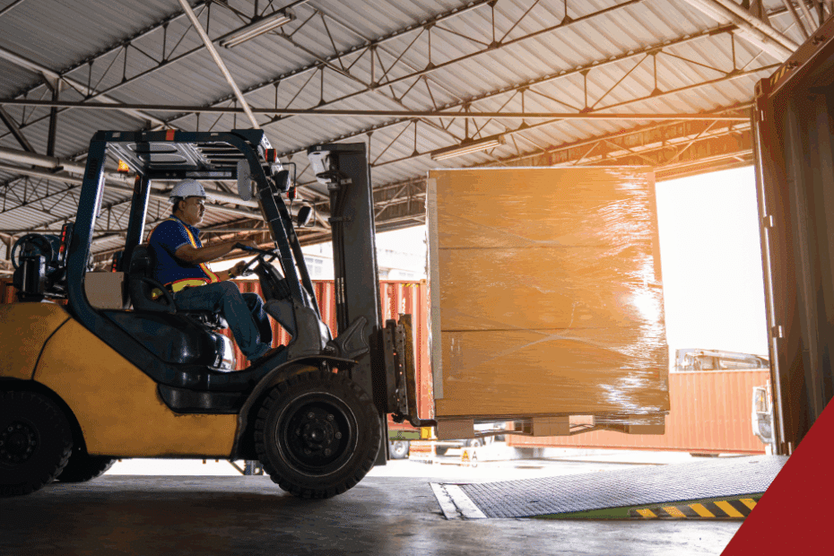 dock worker loading freight into a trailer