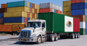 image of cargo containers behind a truck with a Mexican flag
